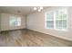 Spacious living room with abundant natural light and sleek floors at 194 Wilhelmina Dr, Austell, GA 30168