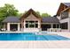 Beautiful backyard featuring a pool, outdoor kitchen, and modern design perfect for entertaining at 250 Mayfield Rd, Alpharetta, GA 30009