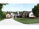 An inviting front view showcases the home's unique architecture and manicured landscaping at 250 Mayfield Rd, Alpharetta, GA 30009