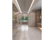 Long hallway features smooth floors, neutral walls, recessed lighting, chandelier and glass doors on left at 250 Mayfield Rd, Alpharetta, GA 30009