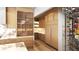 Shows custom wood cabinets, marble backsplash, wine rack, and stainless steel appliances at 250 Mayfield Rd, Alpharetta, GA 30009