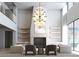 Bright living room with modern fireplace, hardwood floors, overhead chandelier and many places to sit at 250 Mayfield Rd, Alpharetta, GA 30009
