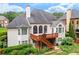 Home featuring a wooden deck, large windows, and landscaped backyard at 3348 Perrington Pointe, Marietta, GA 30066