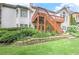 Spacious backyard features a raised deck with stairs, lush greenery and retaining wall at 3348 Perrington Pointe, Marietta, GA 30066