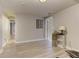 Finished basement area featuring neutral paint, vinyl floors, and a separate doorway at 3348 Perrington Pointe, Marietta, GA 30066