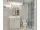 Bathroom with a walk-in shower featuring marble-look tile, glass door, white vanity, and new fixtures at 3348 Perrington Pointe, Marietta, GA 30066