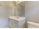 Bright bathroom with vanity, white countertop and cabinetry, large mirror, and toilet at 3348 Perrington Pointe, Marietta, GA 30066