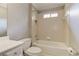Bathroom with white tiled shower and bathtub, toilet, and sink with white countertop and cabinetry at 3348 Perrington Pointe, Marietta, GA 30066