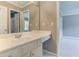 Bathroom with white countertop and cabinetry, large mirror, sink, and doorway to another room at 3348 Perrington Pointe, Marietta, GA 30066