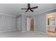 Bedroom features closet, ceiling fan, and doorway to a bathroom with a white sink and cabinetry at 3348 Perrington Pointe, Marietta, GA 30066