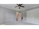 Bedroom features closet, ceiling fan, and doorway to a bathroom with a white sink and cabinetry at 3348 Perrington Pointe, Marietta, GA 30066