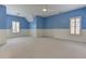 Large bedroom with blue and white walls, carpet, ceiling fan, and a window with plantation shutters at 3348 Perrington Pointe, Marietta, GA 30066