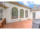 Back deck with large arched windows, and a grill overlooking the lush greenery at 3348 Perrington Pointe, Marietta, GA 30066
