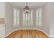 Bright dining area features beautiful bay windows, modern lighting and hardwood floors at 3348 Perrington Pointe, Marietta, GA 30066