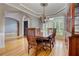 Elegant dining room with hardwood floors, chandelier, and view into the entry at 3348 Perrington Pointe, Marietta, GA 30066