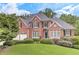 Elegant brick home boasts meticulous landscaping and an inviting curb appeal at 3348 Perrington Pointe, Marietta, GA 30066