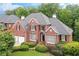 Inviting two-story brick home with a well-maintained yard and lush landscaping at 3348 Perrington Pointe, Marietta, GA 30066