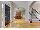 Elegant foyer with hardwood floors, staircase, and views into the dining room at 3348 Perrington Pointe, Marietta, GA 30066