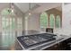 Bright kitchen with granite countertops, a cooktop island, and window views at 3348 Perrington Pointe, Marietta, GA 30066