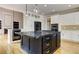 Spacious kitchen offers a large island, white cabinetry, and built-in stainless steel appliances at 3348 Perrington Pointe, Marietta, GA 30066