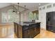 Open kitchen features a large island, stainless appliances, and ample cabinet space at 3348 Perrington Pointe, Marietta, GA 30066