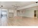 Spacious living room featuring hardwood floors, neutral paint, ceiling fan, and built-in cabinets at 3348 Perrington Pointe, Marietta, GA 30066