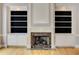 Traditional living room with fireplace and built-in bookcases at 3348 Perrington Pointe, Marietta, GA 30066