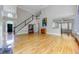 Bright living room boasts soaring ceilings, hardwood floors, and a grand staircase at 3348 Perrington Pointe, Marietta, GA 30066