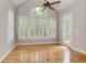 Spacious living room boasts a vaulted ceiling, transom window, and access to the outdoor deck at 3348 Perrington Pointe, Marietta, GA 30066