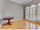 Bright living room with hardwood floors and natural light streaming through shuttered windows at 3348 Perrington Pointe, Marietta, GA 30066