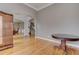 Open-concept living space featuring hardwood floors, neutral paint, and an archway to the dining area at 3348 Perrington Pointe, Marietta, GA 30066