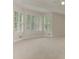 Large main bedroom offers ample natural light through big windows and neutral carpet at 3348 Perrington Pointe, Marietta, GA 30066