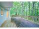 View of wood deck with railing overlooking lush trees at 3480 Stillridge Dr, Alpharetta, GA 30022