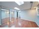 Basement featuring hardwood flooring, three mirrorred closets and recessed lighting at 3480 Stillridge Dr, Alpharetta, GA 30022