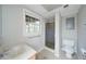 Bathroom with tile floor, single sink vanity, and glass enclosed shower at 3480 Stillridge Dr, Alpharetta, GA 30022