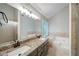 Bathroom with a granite countertop vanity, a glass shower, and a soaking tub at 3480 Stillridge Dr, Alpharetta, GA 30022