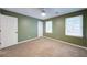 Bedroom with neutral carpet flooring and two windows that offer plenty of natural light at 3480 Stillridge Dr, Alpharetta, GA 30022
