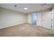 Bedroom featuring carpet floors, neutral paint, and two closets for ample storage at 3480 Stillridge Dr, Alpharetta, GA 30022