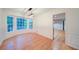 Dining room with hardwood floors and wainscoting details, complemented by a bright bay window at 3480 Stillridge Dr, Alpharetta, GA 30022