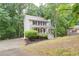 Traditional two-story home with front porch and manicured landscaping at 3480 Stillridge Dr, Alpharetta, GA 30022