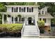 Charming two-story home featuring a welcoming front porch, black shutters, and well-maintained landscaping at 3480 Stillridge Dr, Alpharetta, GA 30022
