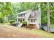 Charming two-story house with lush landscaping and front porch at 3480 Stillridge Dr, Alpharetta, GA 30022