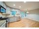Bright kitchen featuring stainless steel appliances, granite countertops, and a charming breakfast nook area at 3480 Stillridge Dr, Alpharetta, GA 30022
