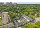 Aerial view of townhouse complex featuring a pool and lush surroundings at 3501 Roswell Ne Rd # 102, Atlanta, GA 30305