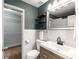 Updated bathroom features white tile, gray walls, modern vanity and access to a walk-in closet at 3501 Roswell Ne Rd # 102, Atlanta, GA 30305