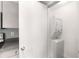A laundry closet offers a stacked washer and dryer and some cabinet space at 3501 Roswell Ne Rd # 102, Atlanta, GA 30305