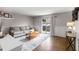 Well-lit living room features wood trim, hardwood floors, stylish furniture, and a sliding door to the outside at 3501 Roswell Ne Rd # 102, Atlanta, GA 30305