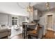Living room and kitchen features gray walls, hardwood floors, and neutral tones for modern aesthetic at 3501 Roswell Ne Rd # 102, Atlanta, GA 30305
