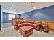 Finished basement with a built-in wet bar and comfortable leather seating area at 9900 Hunt Club Way, Johns Creek, GA 30022