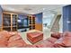 Finished basement with a large entertainment center and comfortable leather seating at 9900 Hunt Club Way, Johns Creek, GA 30022